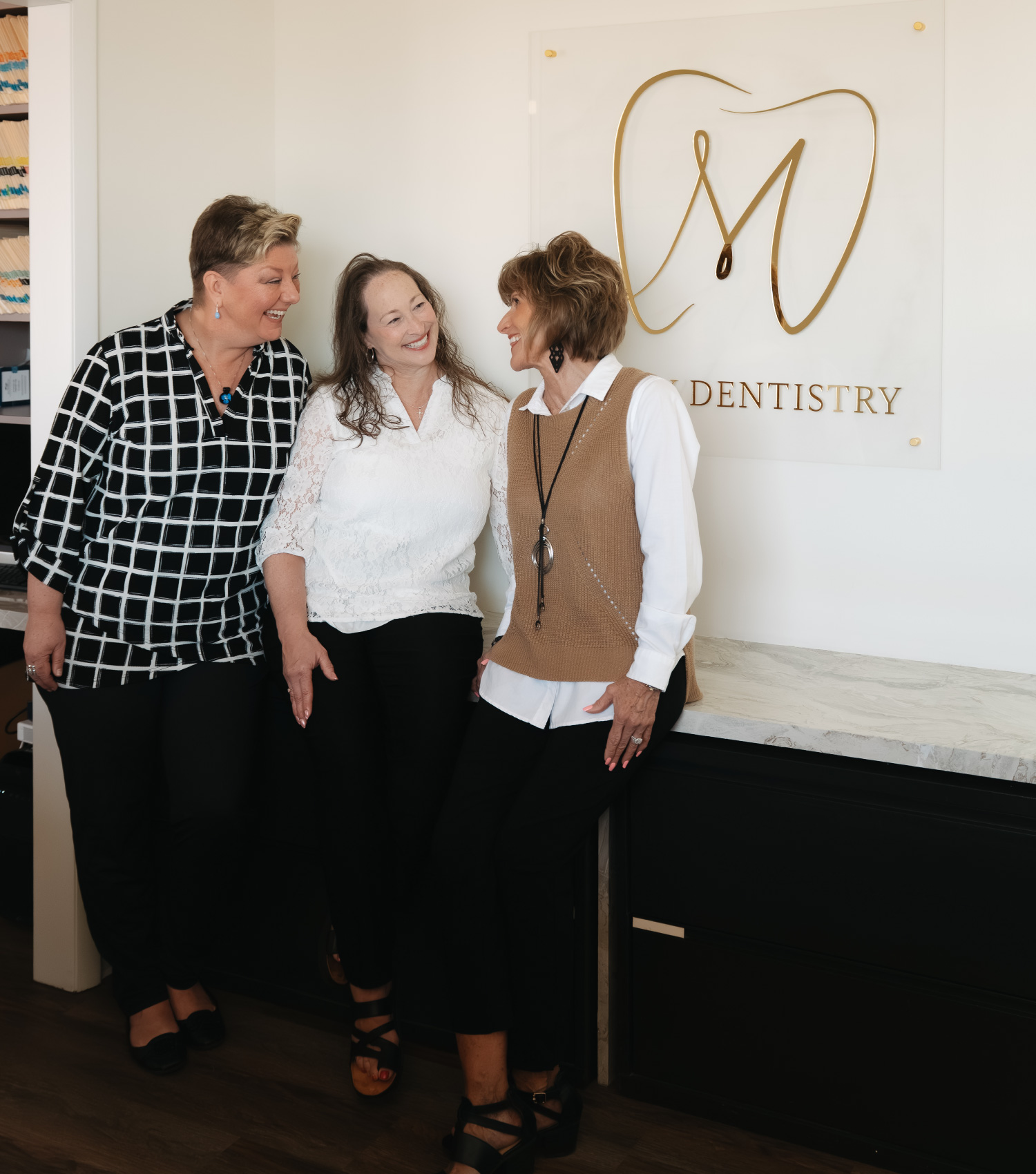 McKay Dentistry staff discussing low cost dental care in Wichita